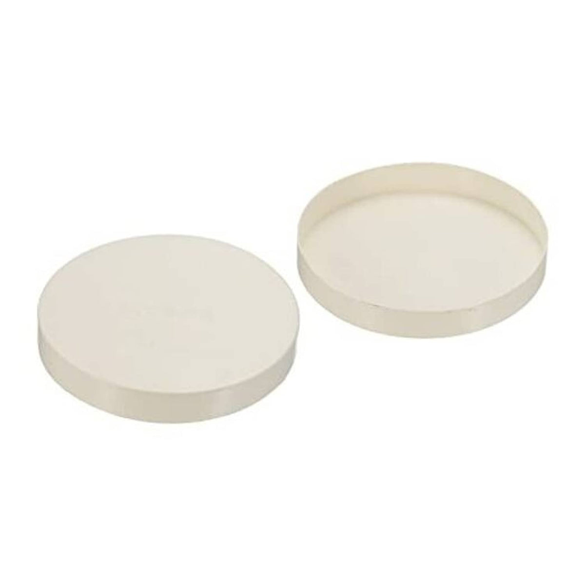 Off-white PVC pipe end caps, two round plugs with flat tops