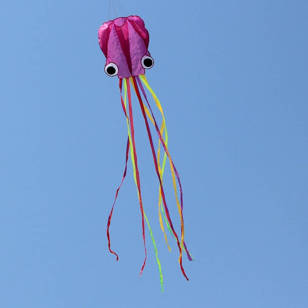 Octopus kite with pink-purple body and dangling rainbow ribbon tail