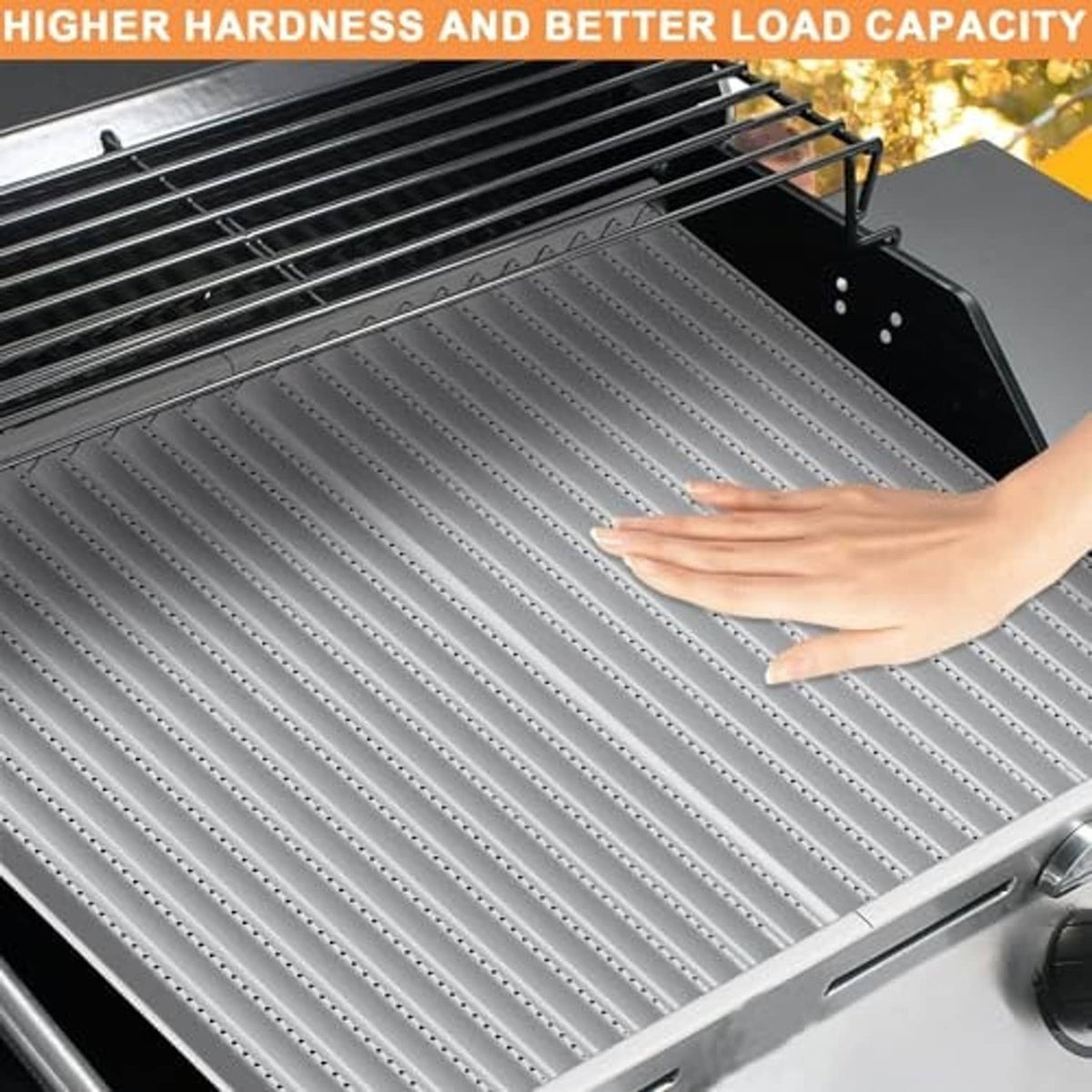 Infrared grill emitter grate surface with vertical channels, shown with hand