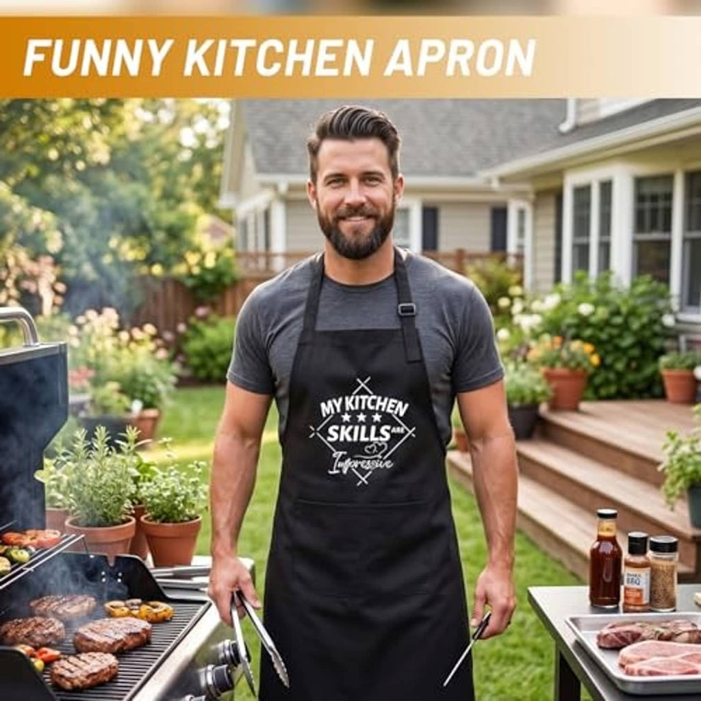 Black funny kitchen apron on outdoor model, front pocket and kitchen skills utensils print