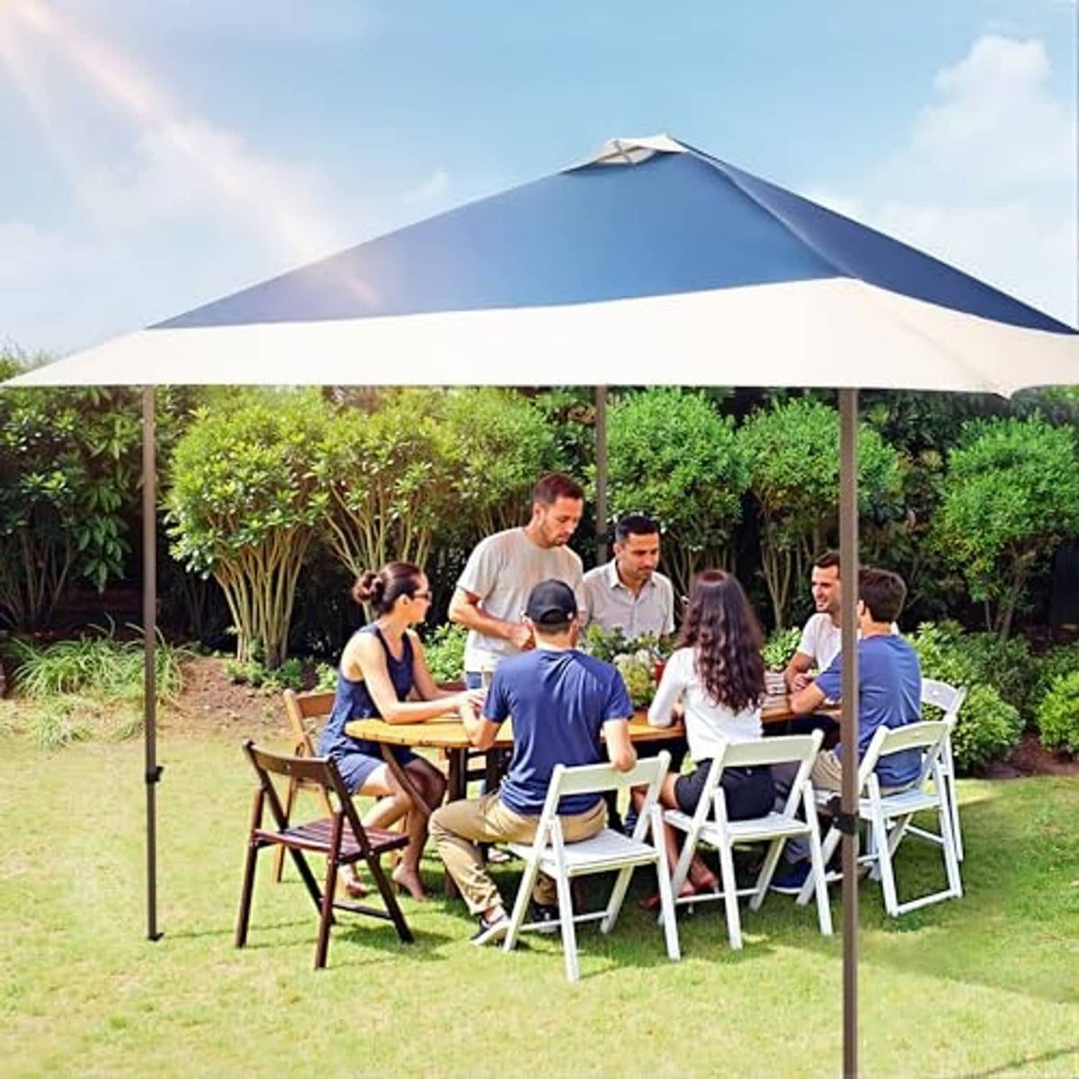 Navy blue and white outdoor canopy top replacement over a table and chairs