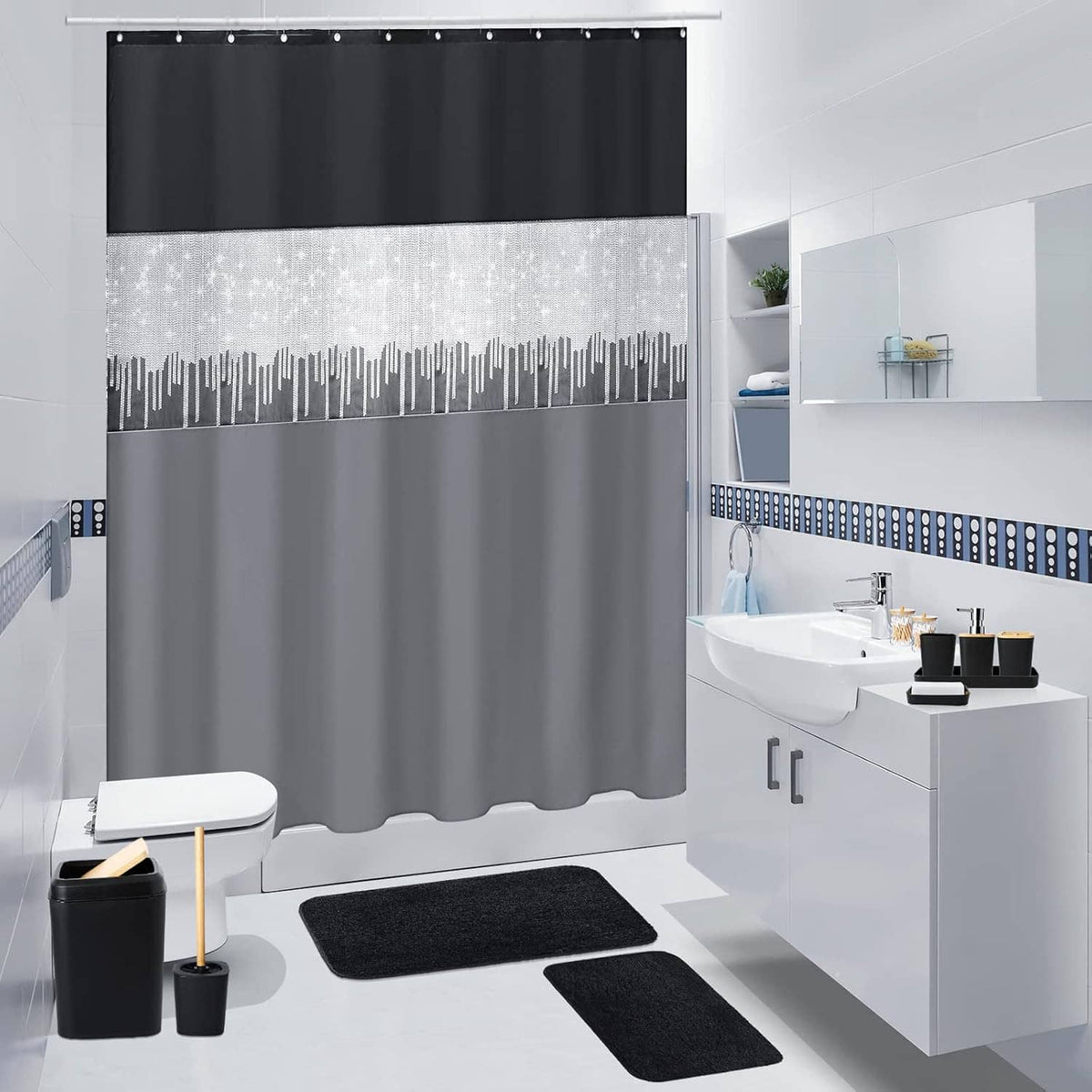 Black shower curtain with gray stripe pattern and two black bathroom rugs in bathroom