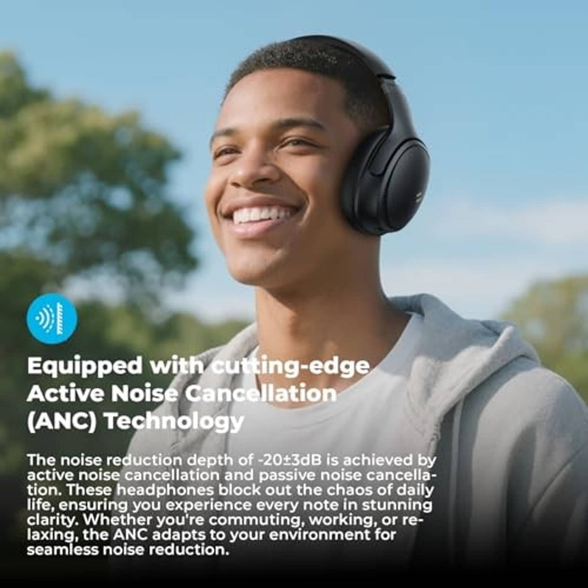 Black over-ear wireless headphones worn on a person’s head, outdoors daytime