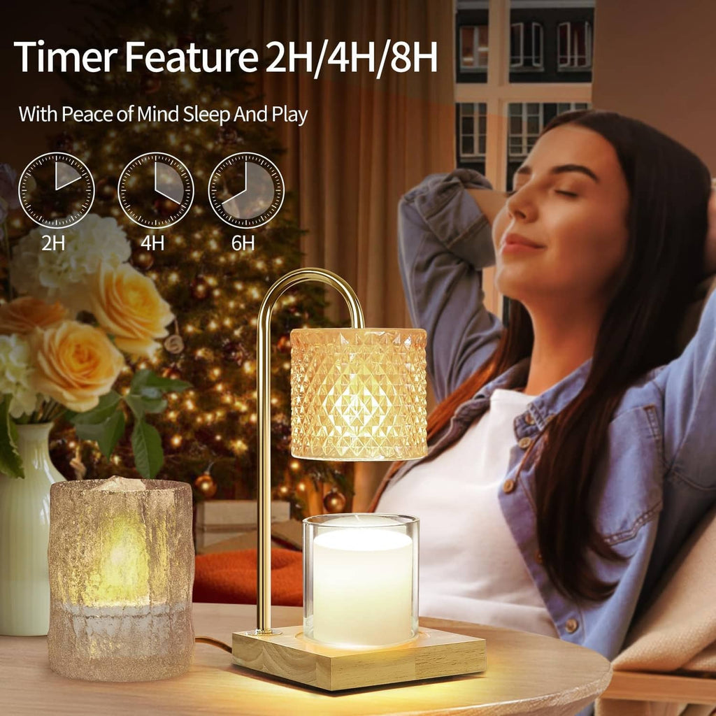 Candle warmer lamp with gold stand and amber textured glass shade, lit candle on wooden base