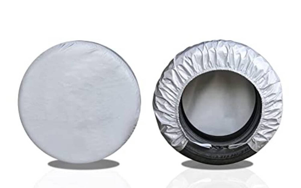 Silver RV tire cover pair, front and side views with center cutout opening