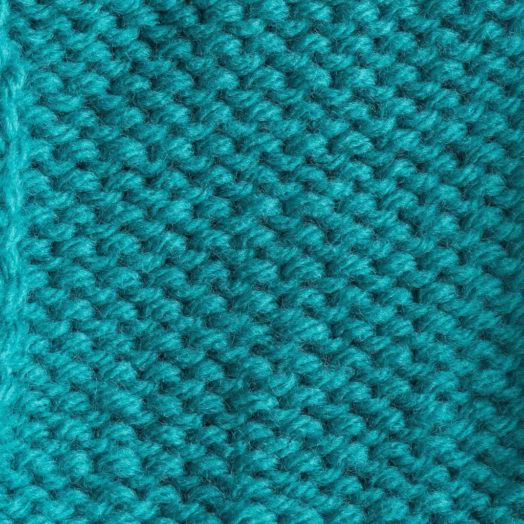 Turquoise crochet stitch swatch with dense raised loops texture