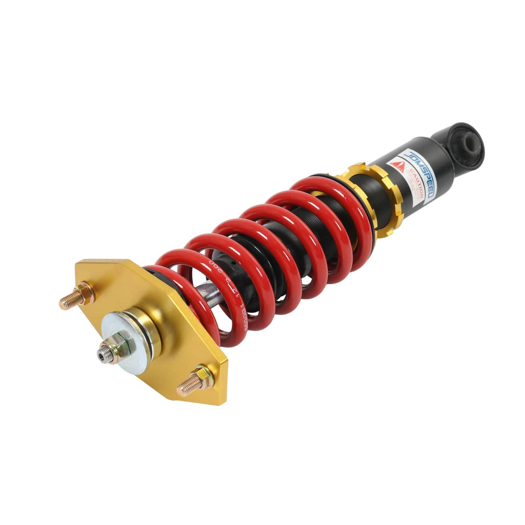 Coilover shock absorber with red spring, black damper, and gold control collar