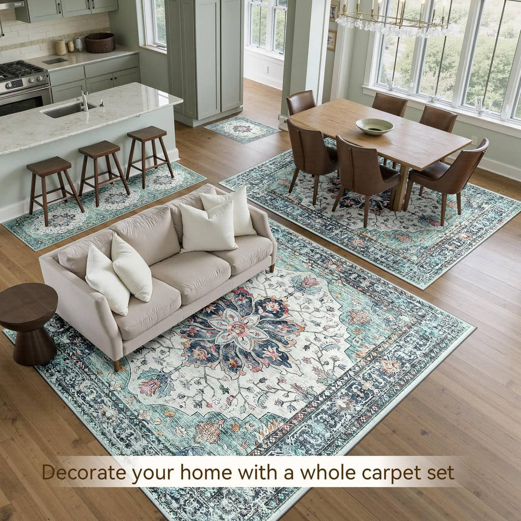 Large rectangular area rug with teal, white, and navy ornate pattern in a dining room
