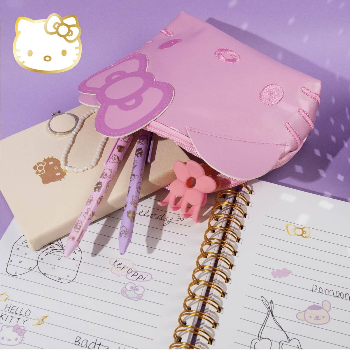 Pink Hello Kitty mini pouch with faux-leather finish, cat-ear flap, and gold zipper