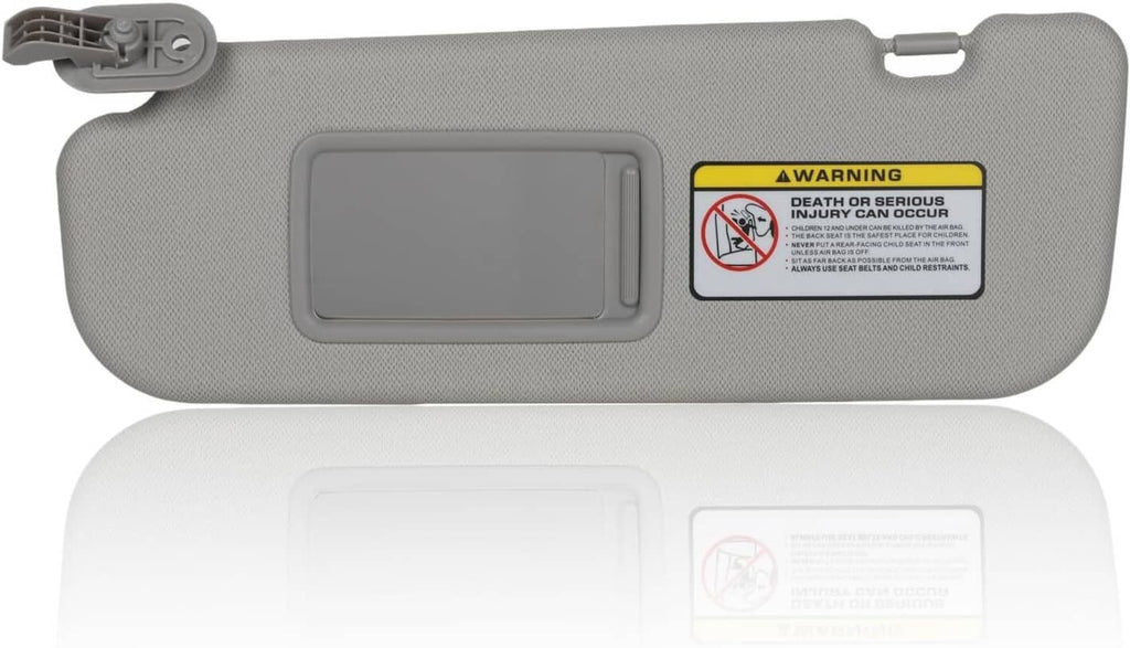 Grey sun visor with large vanity mirror window and warning label, full-length view