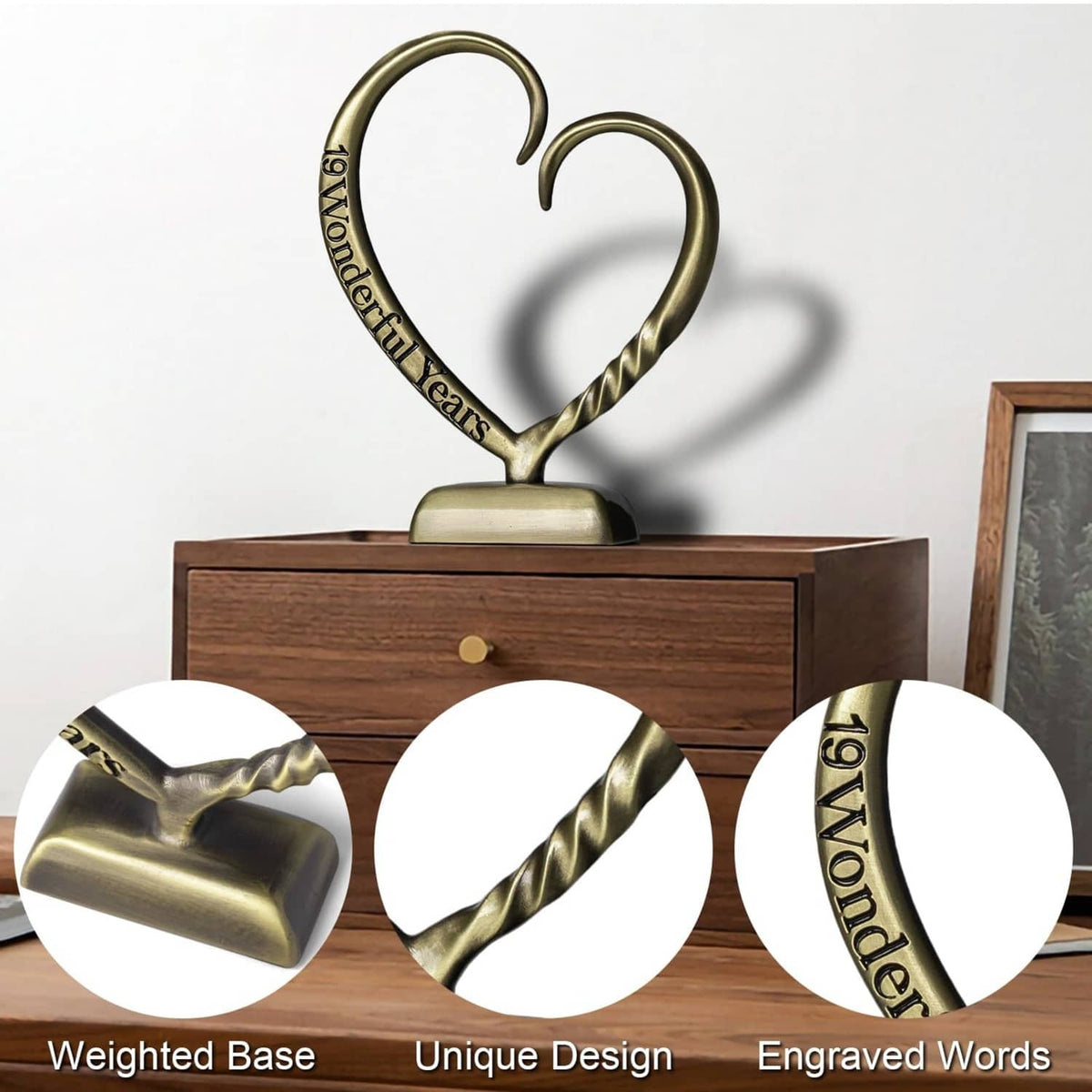 Bronze heart anniversary sculpture on a weighted base with engraved ribbon
