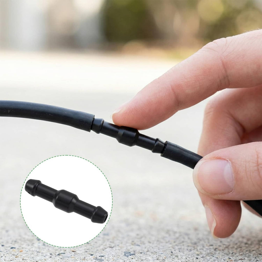 Black windshield washer hose connector section held by hand