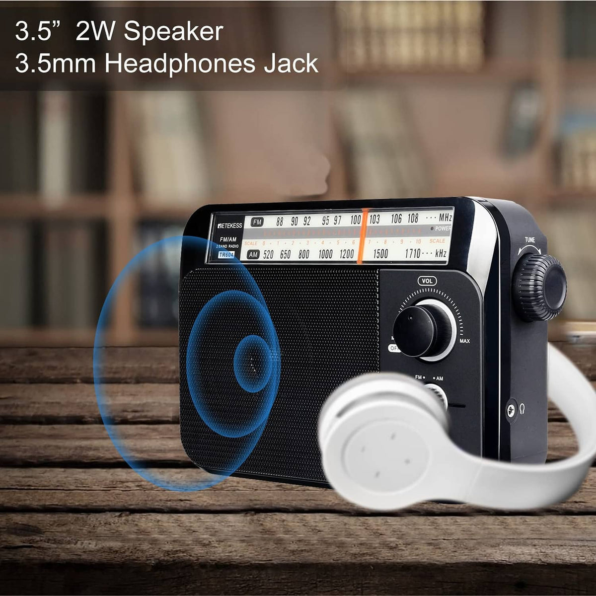 Portable AM/FM radio with speaker grille and headphone jack area on the front side