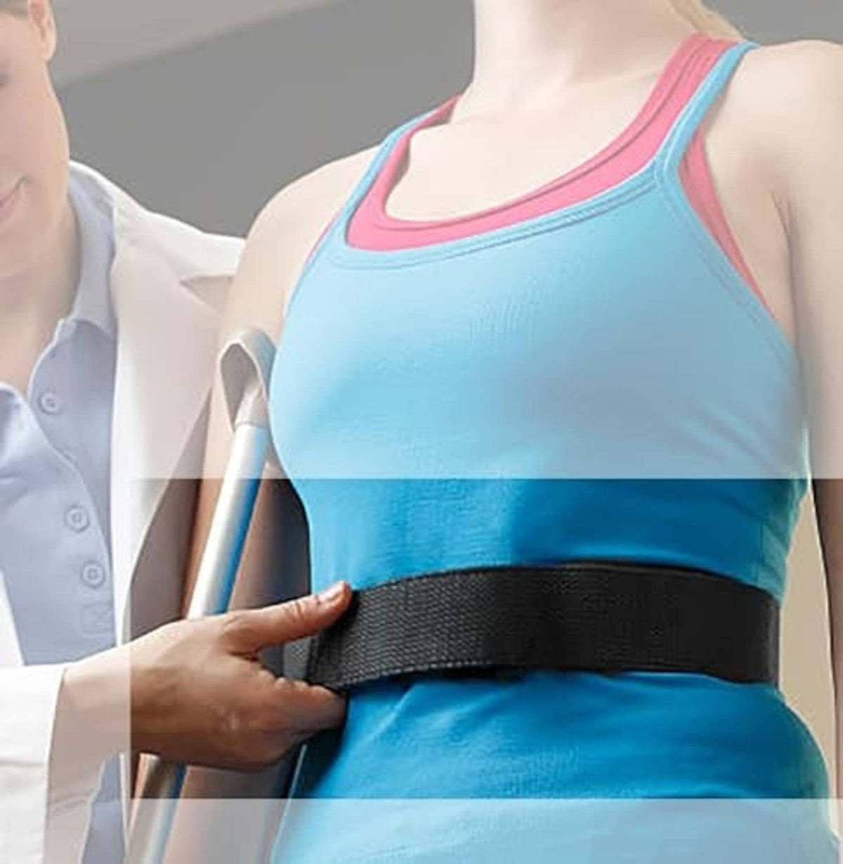 Pink gait transfer belt with metal buckle worn over blue athletic top