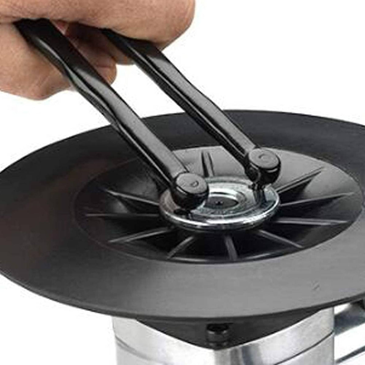 Hand using adjustable pin tool on a round metal head with pins
