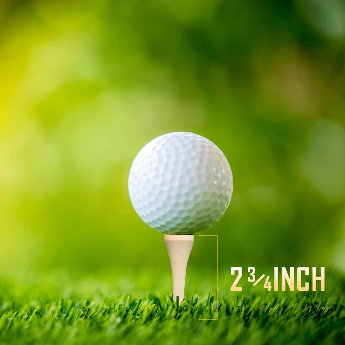 Golf ball on a light wood 2-3/4 inch tee, on grass