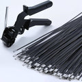Black cable tie gun with metal zip ties and stainless steel fasteners, ready to use