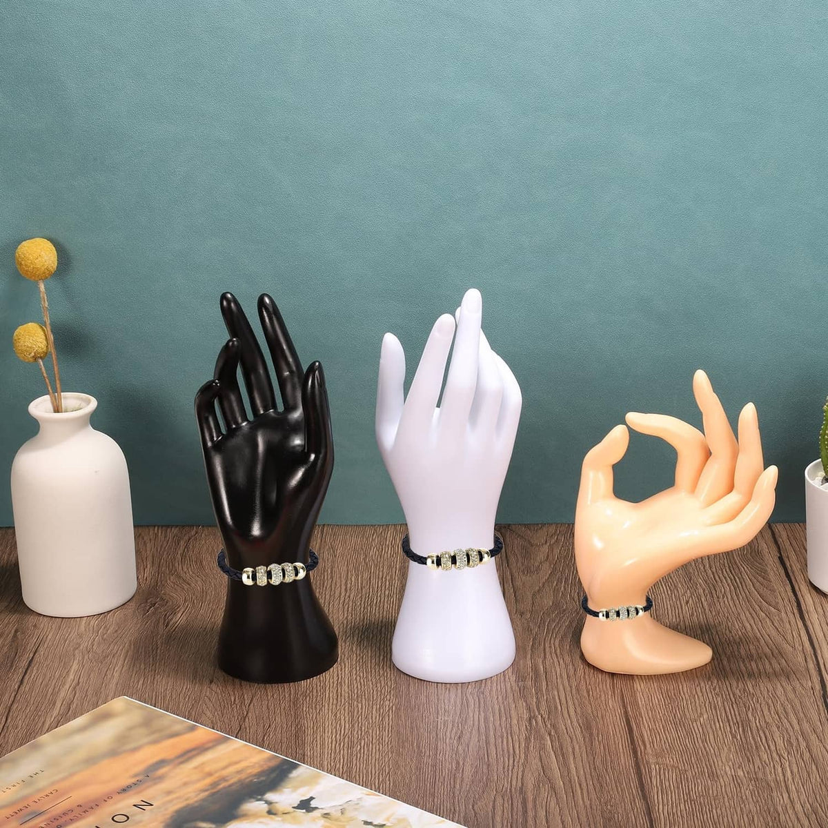 White plastic hand ring holder display stand on wrist base, ring slots