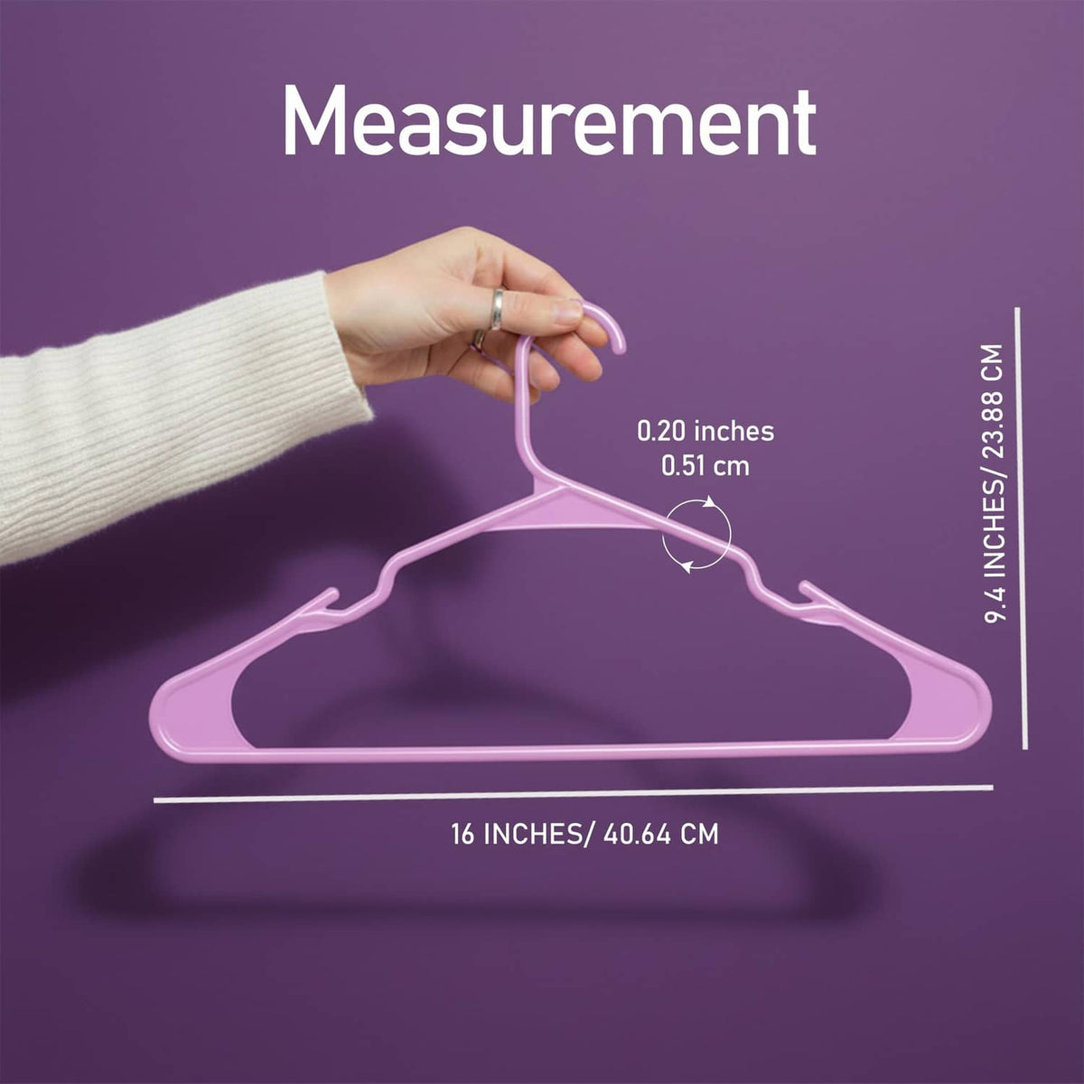 Pink plastic hanger held by hand with length and width measurement lines