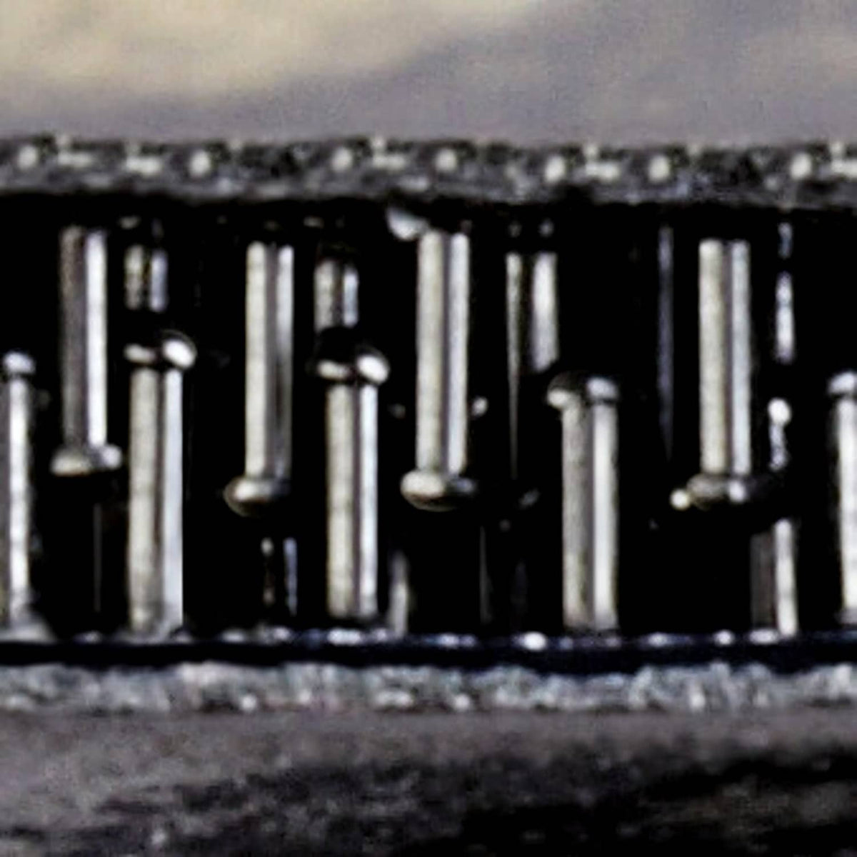 Extreme close-up of black interlocking fastener hooks