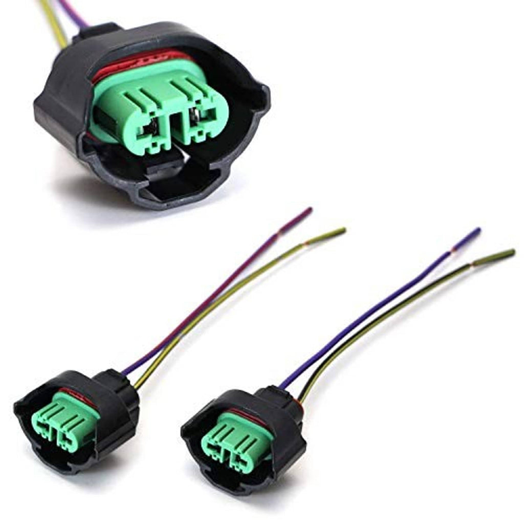 Two female H11/H8 wiring harness adapters with green connectors and color-coded pigtail wires