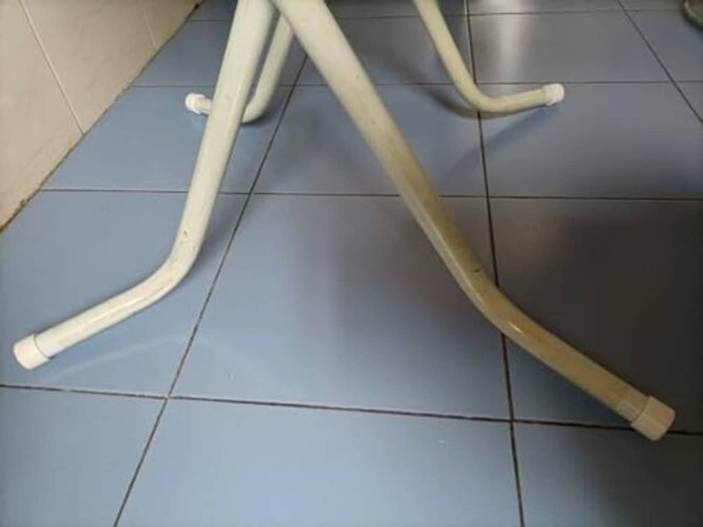 White PVC pipe sections with small end caps attached on tube ends