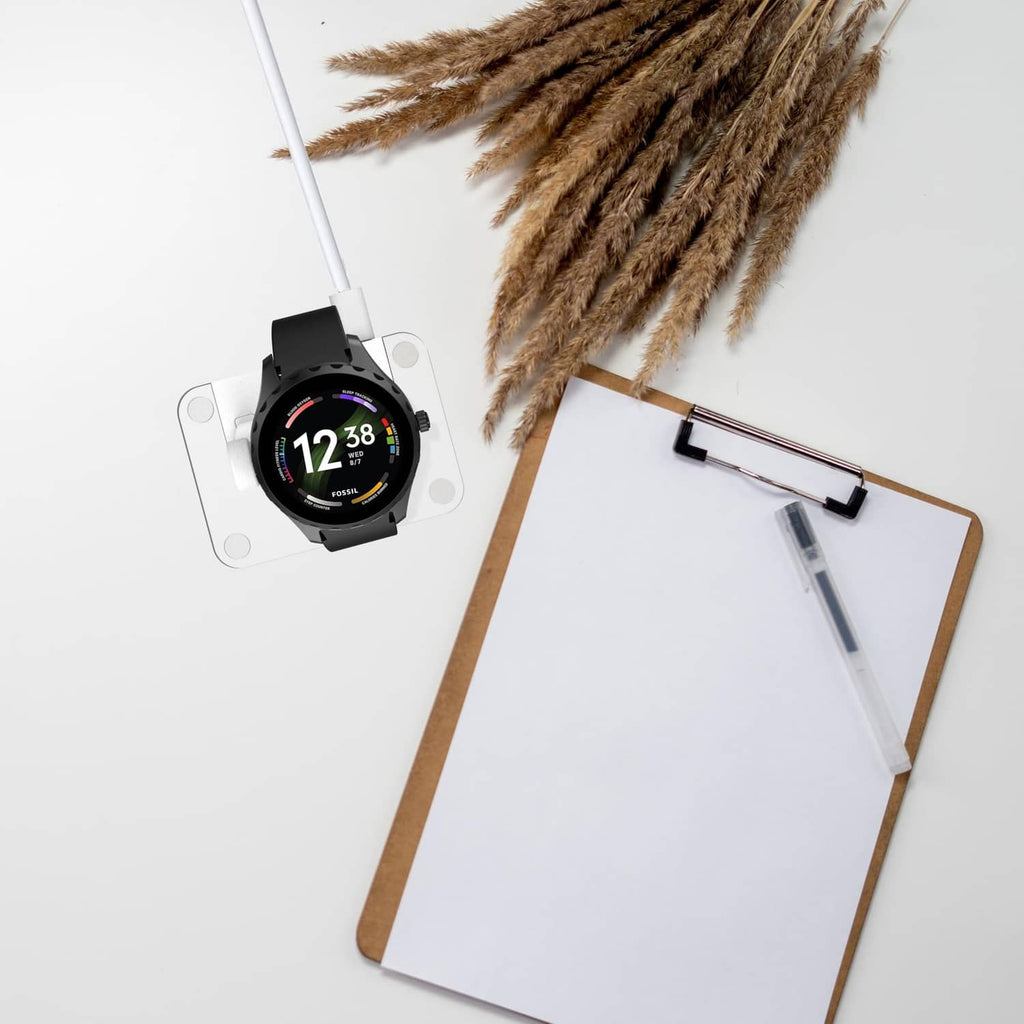 White 4-pin watch charger stand with charging cable and compact base.