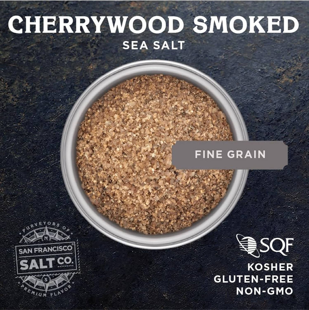 Small bowl of cherrywood smoked sea salt, fine grain, dark brown speckled texture