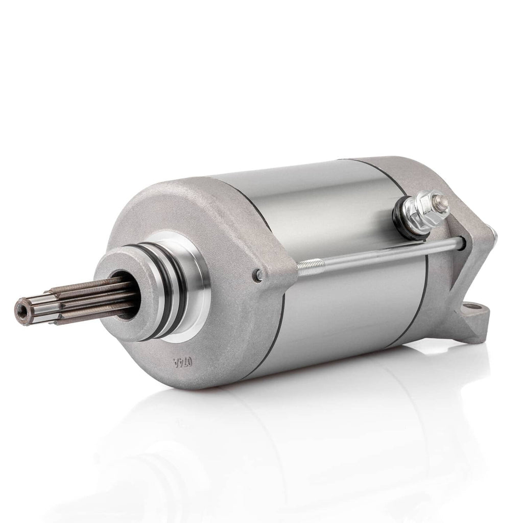 Starter motor with silver metal housing, side view with mounting tabs and bolts.