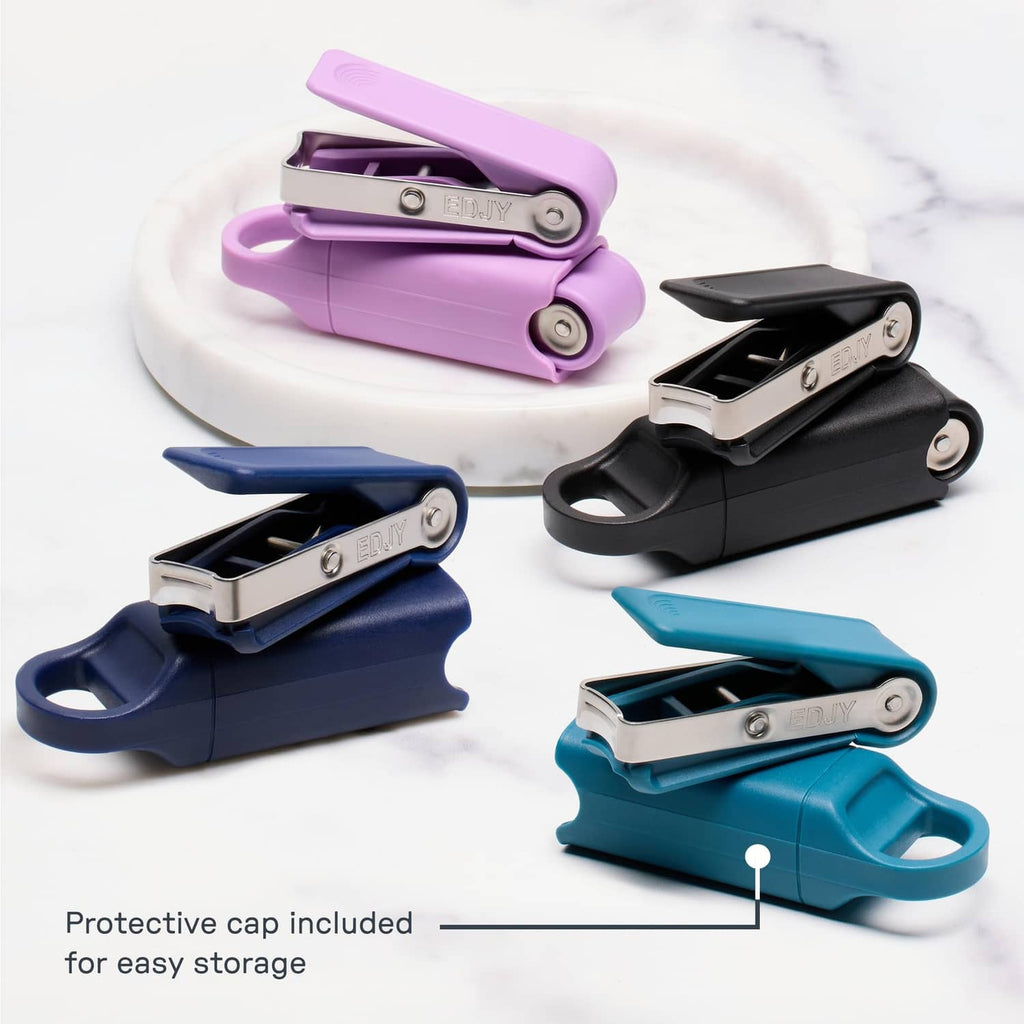 Set of fingernail cutters with protective caps in lilac, blue, and black colors.