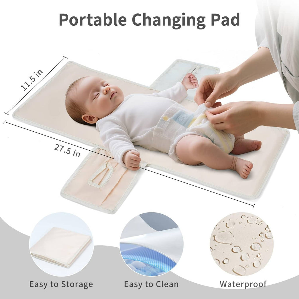 Green diaper bag backpack with portable changing pad included, sized for easy storage.