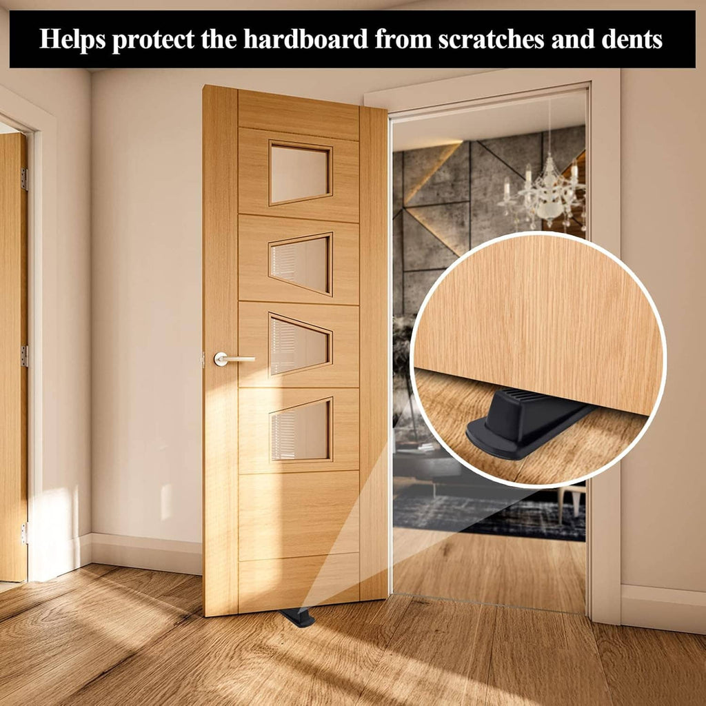Rubber door stopper wedge placed under a wooden door to help prevent scuffs.