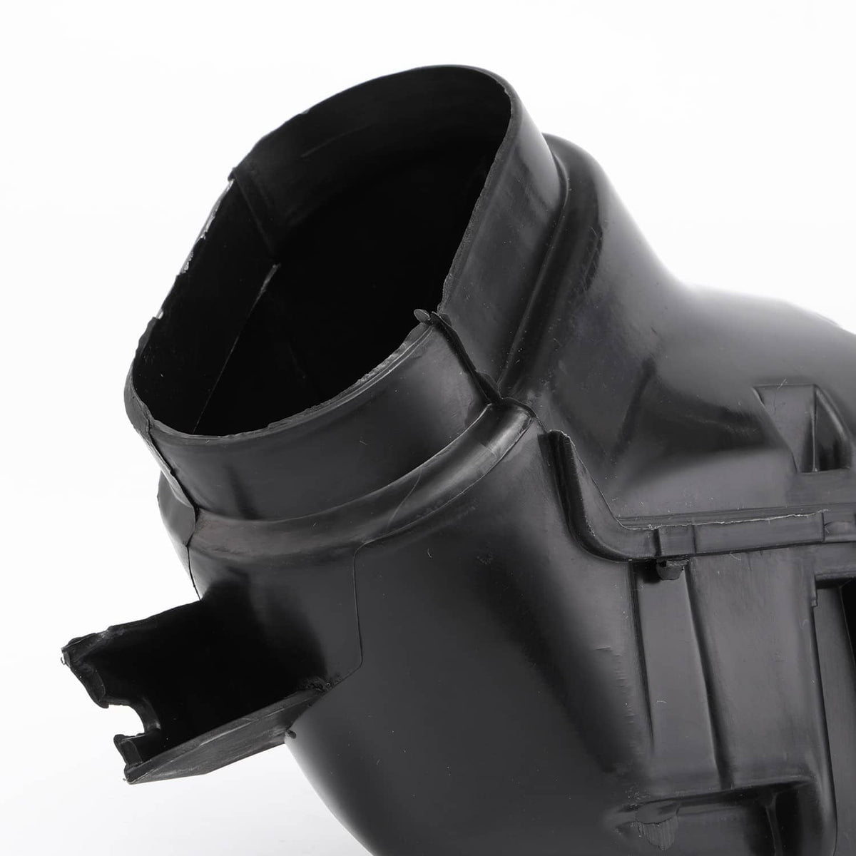 Black intake duct opening with molded mounting tabs and air passage