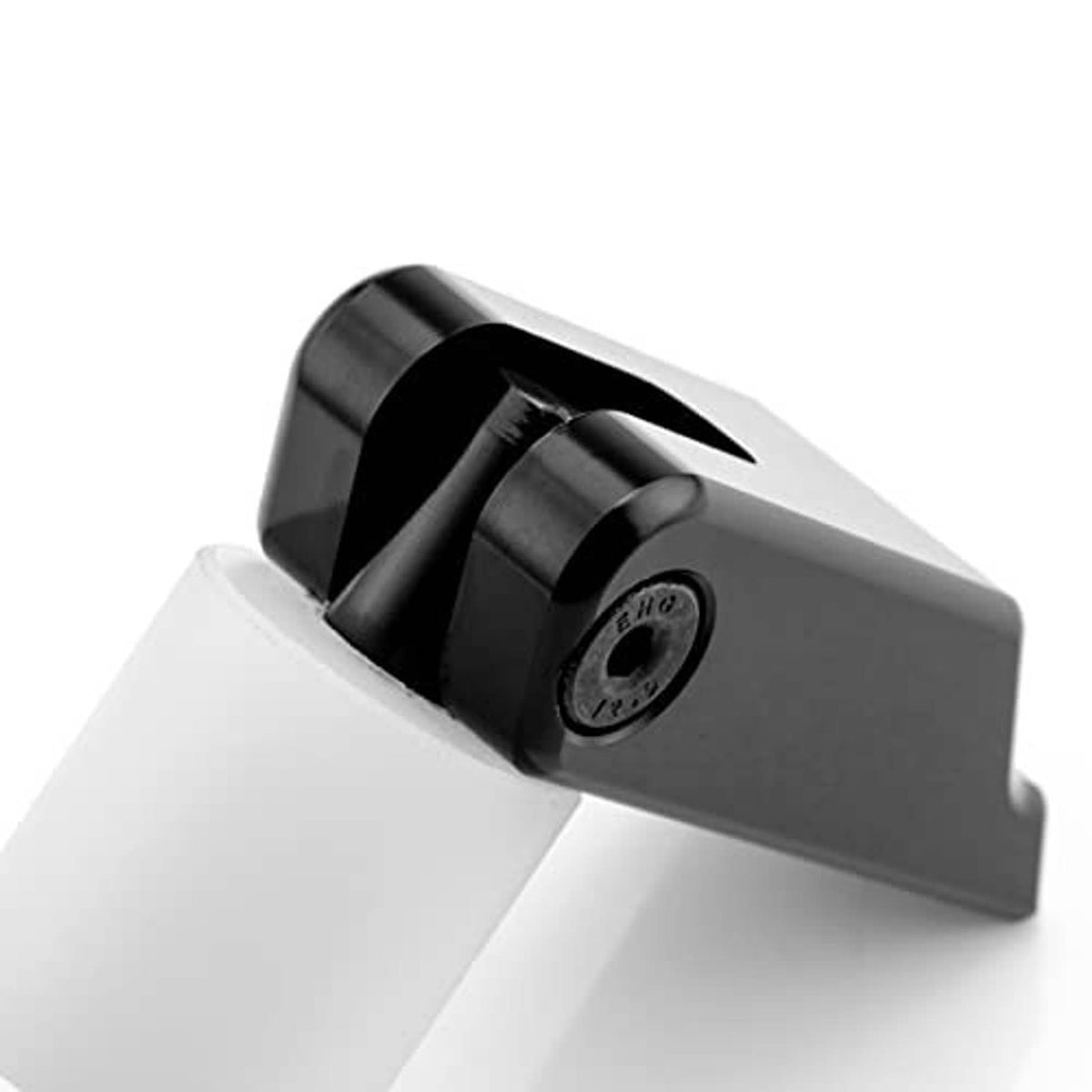 Latch kit close-up showing black bracket interior and circular mounting hardware