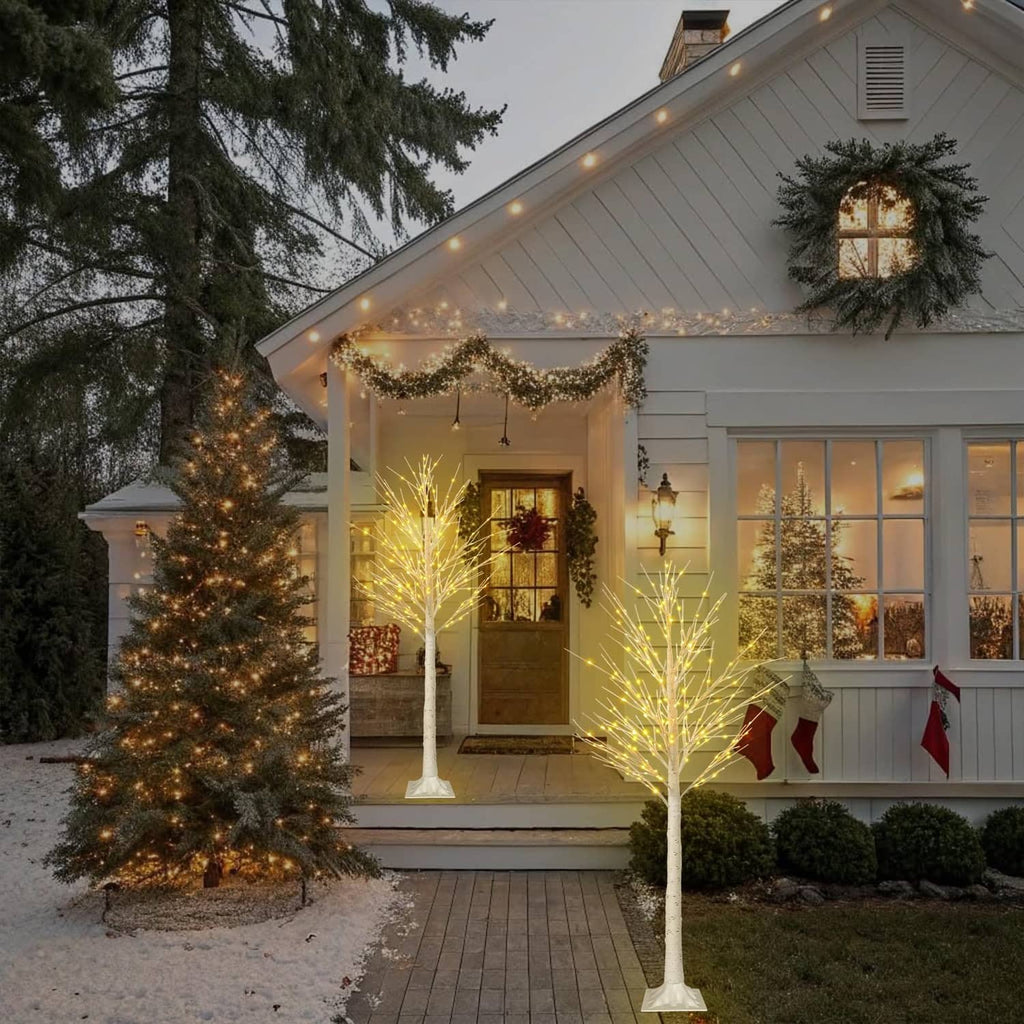 6 ft LED lighted birch tree decoration with warm white lights on exterior porch