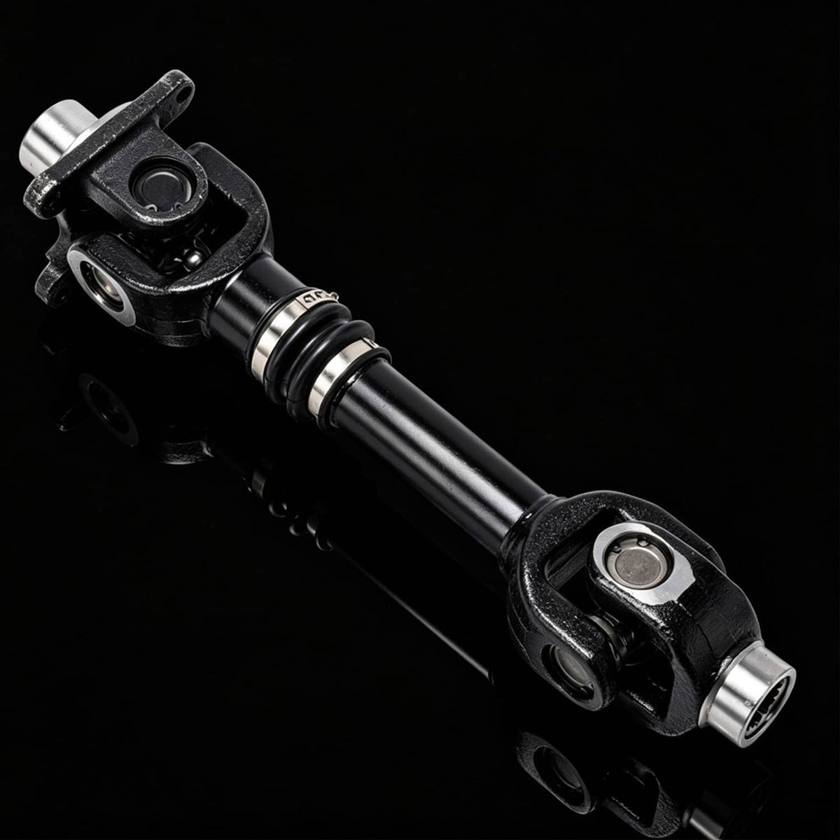 Rear prop drive shaft with black boots and chrome metal joint housings