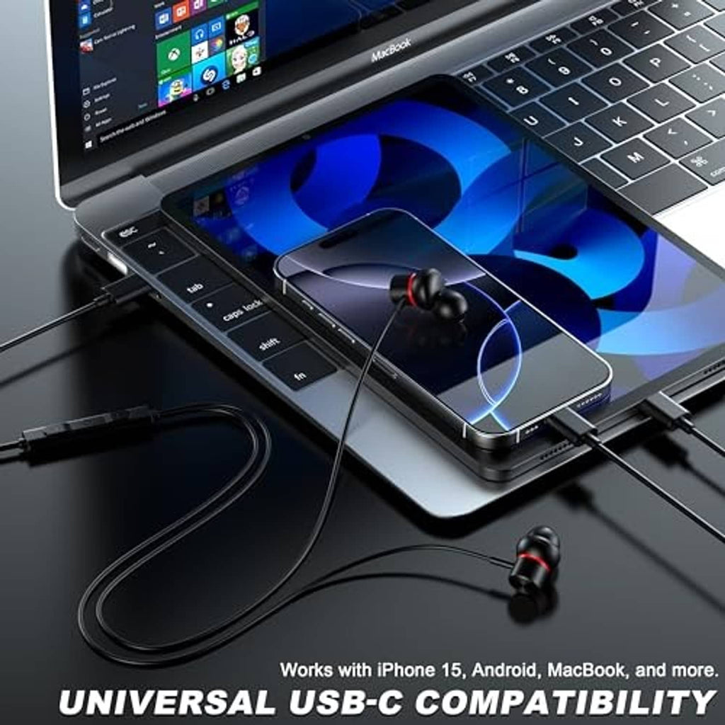 Black wired USB-C earbuds connected to a laptop, showing inline control cable