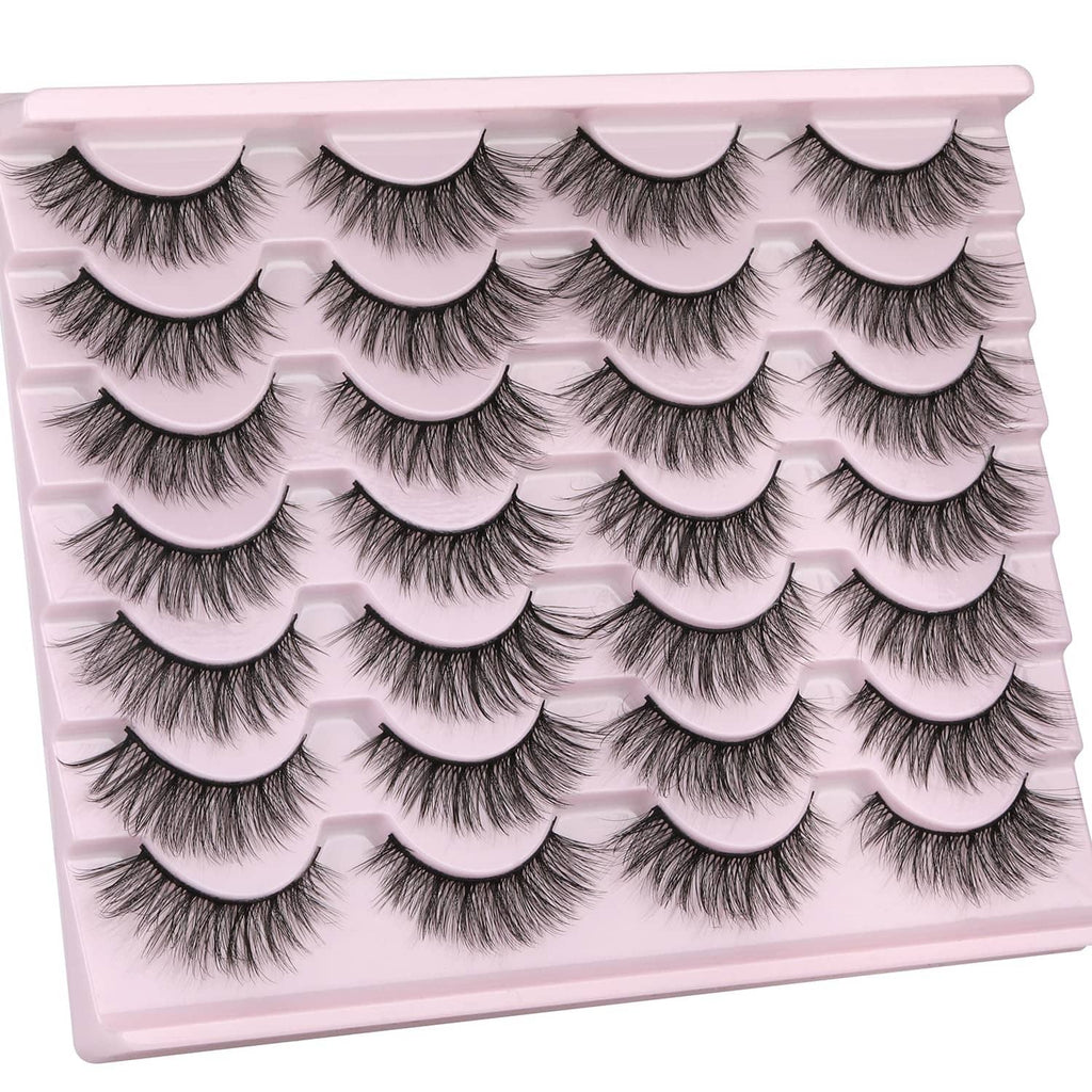 Black wispy faux mink false eyelashes, multiple curved pairs on tray