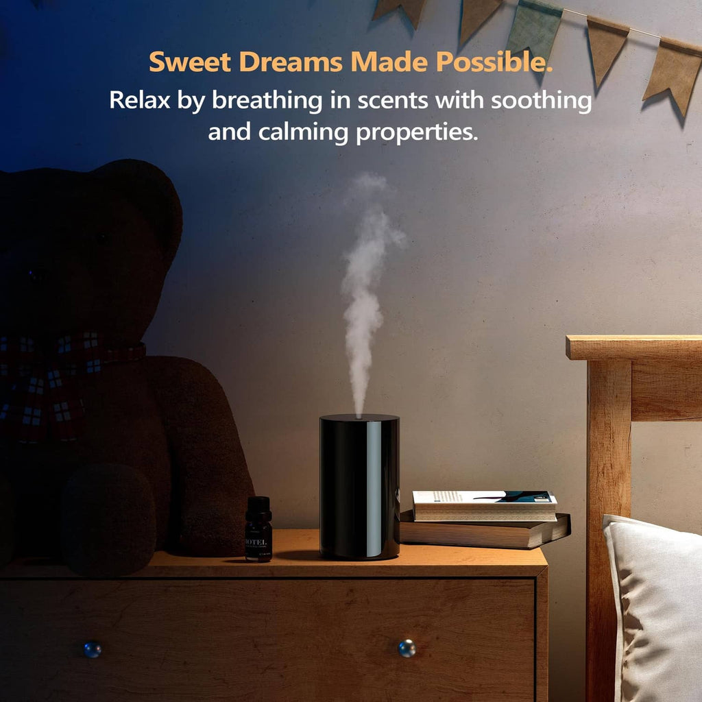 Black waterless diffuser on a nightstand with steady mist output