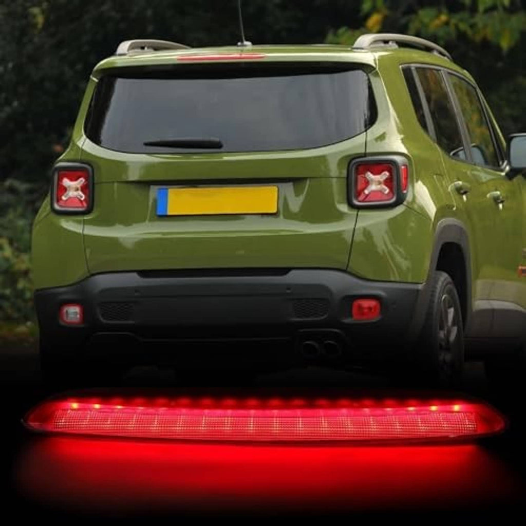 High mount third brake light illuminated in red LED strip at vehicle rear