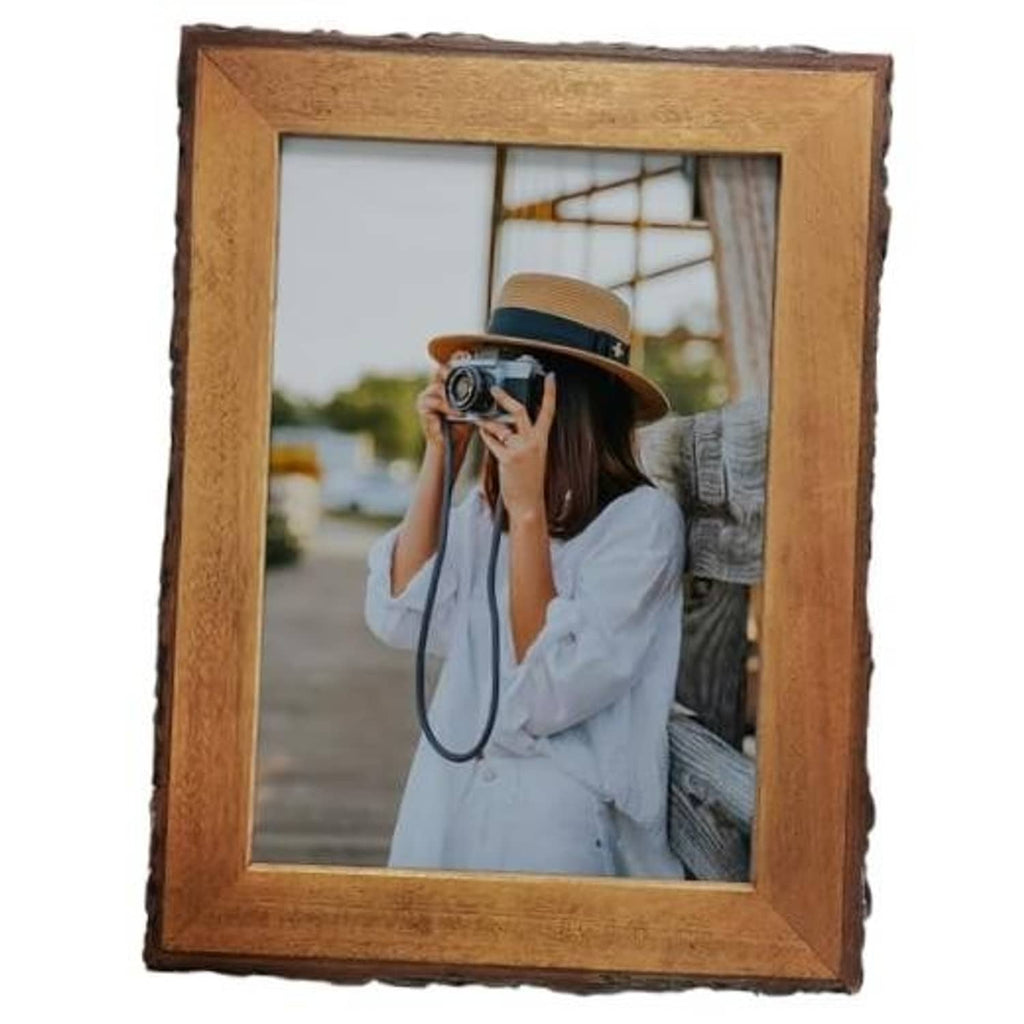 Rustic live-edge wood picture frame with brown border and clear glass opening