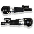 Front air suspension strut pair with black rubber bellows and silver metal shock body