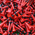 Red golf tees with black striped shafts and rounded heads; close-up of many tees