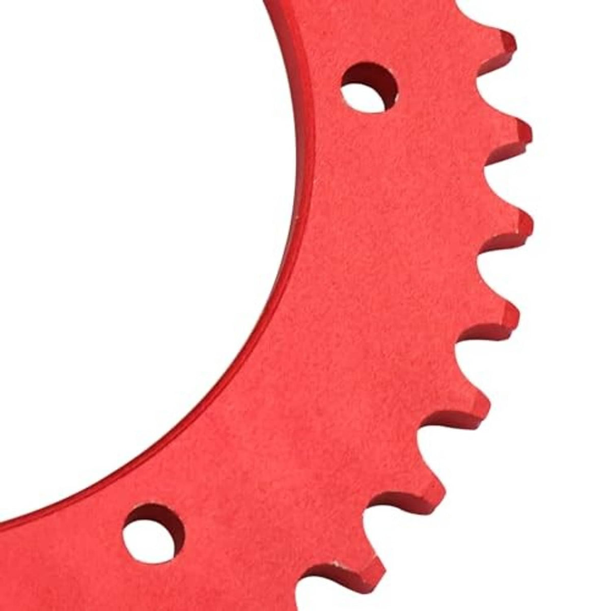 Close-up of red 420 chain sprocket teeth and mounting holes on split plate