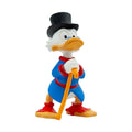 Small hand-painted duck figurine with black top hat, blue coat, and gold cane