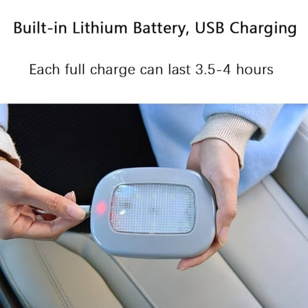 Gray portable car LED light in hands, USB rechargeable style, glowing white front