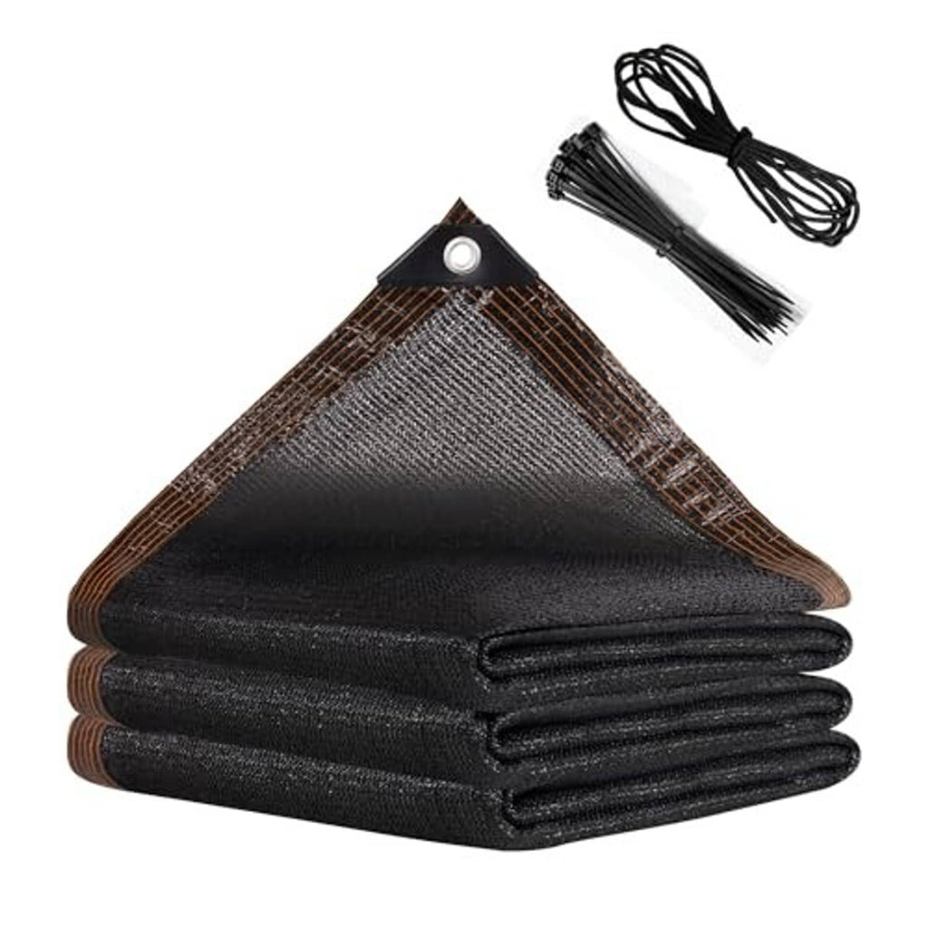Black shade net roll and bundle of black ropes with copper-brown grommeted edge