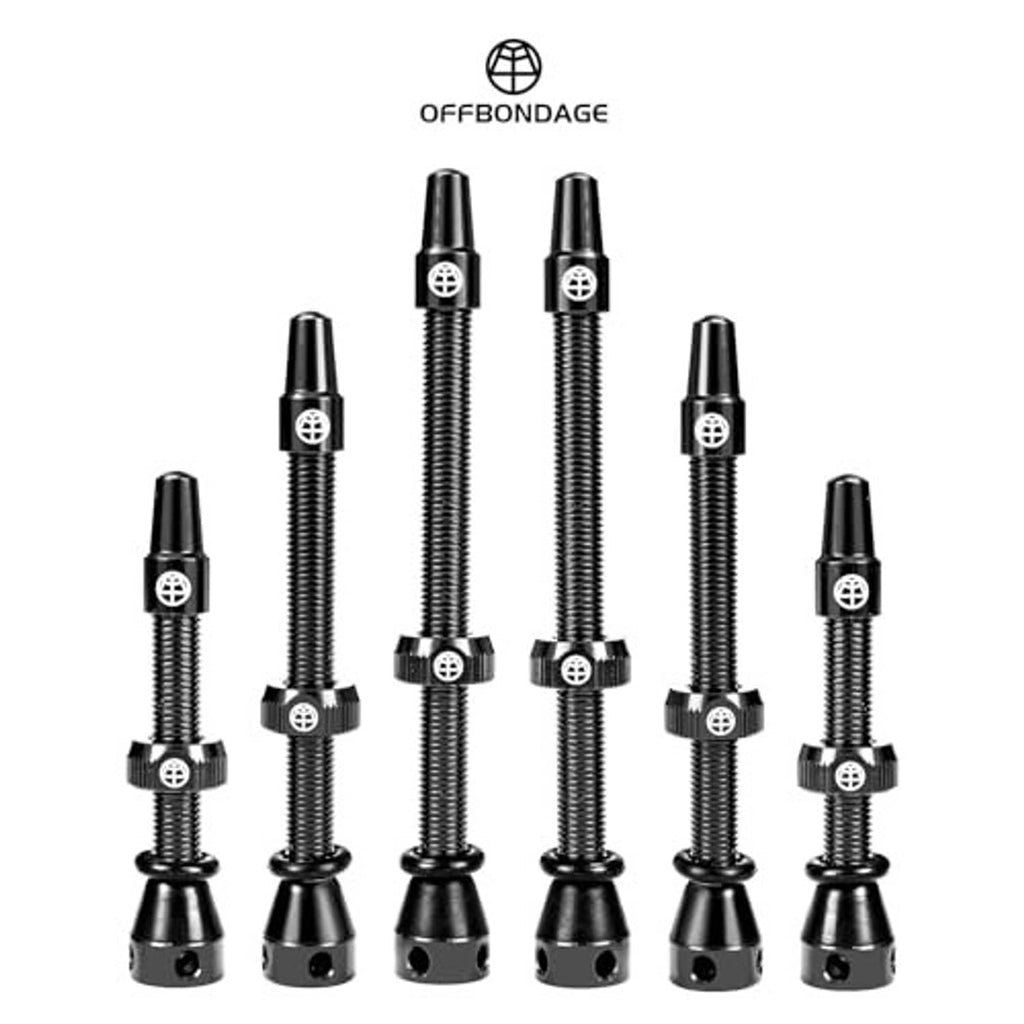Assorted black alloy tubeless Presta valve stems set with caps, multiple lengths shown