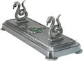 Slytherin wand stand with two silver serpent figurines and green emblem on gray base