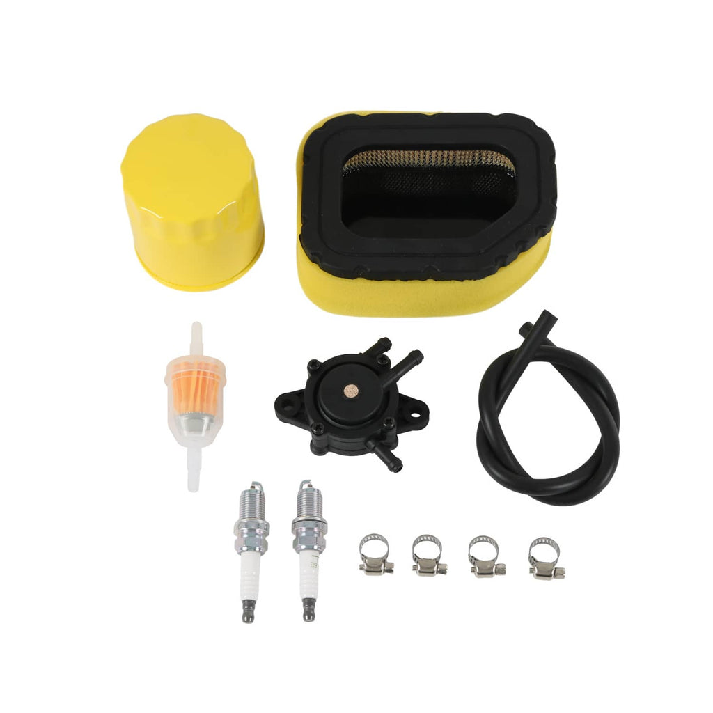 Lawn mower air filter kit with yellow foam filter, black housing, hose, fuel line, spark plugs